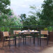 A Flash Furniture rectangular natural faux teak slat table with chairs on a wooden deck.