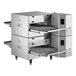 A white Cooking Performance Group double stacked countertop electric conveyor oven with shelves inside.