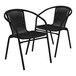 Two black Flash Furniture Lila rattan arm chairs with black wicker.