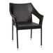 A black synthetic rattan arm chair with metal legs.