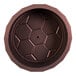 A brown circular steel dish with holes.
