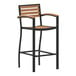 A Flash Furniture Lark bar stool with arms and a wood slat seat.