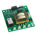 A green circuit board with a black and white electronic device.