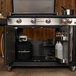 A Blackstone outdoor griddle with a pan and pot on it.