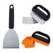 The Blackstone Griddle Essentials 8-Piece Cleaning Kit, including a black and silver spatula, brush, and sponges.