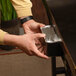 A person opening a box of Blackstone rear grease cup liners.