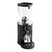 A black Mahlkonig E80W Grind-by-Sync espresso grinder with silver accents.