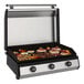 A Blackstone electric drop-in griddle with food cooking on it.