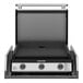 A Blackstone black and silver outdoor kitchen griddle with a lid.