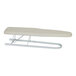 A white ironing board with a white cover.