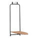 A black iron stand with a Household Essentials ironing board on top.