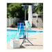 A blue Household Essentials 2-tier drying rack with white and blue towels on it.