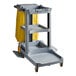 A Lavex Premium gray janitor cart with a yellow bag on it.