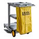 A Lavex Premium janitor cart with a yellow bag.