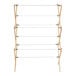 A wooden Household Essentials clothes drying rack with white ropes.