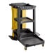 A Lavex Premium black and yellow janitor cart with wheels.