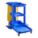 A Lavex Premium blue janitor cart with a yellow bag on it.