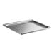 A Vollrath stainless steel 2/3 size steam table pan with a square edge on a counter.