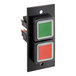 A black rectangular device with a green square button and red and green lights.