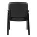 A Boss black leather mid-back executive guest chair with padded armrests.