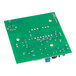A green Mahlkonig power board with many small metal components.