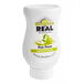 A white bottle of Real Juicy Pear Puree Infused Syrup with a label.