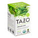 A box of Tazo Organic Zen Green Tea Bags with green leaves on the box.