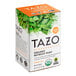 A box of Tazo Organic Refresh Mint Herbal Tea Bags with green leaves on it.