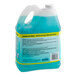 A gallon jug of Simple Green concentrated blue shower, tub, and tile cleaner with a label.