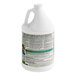 A white container with a label that has green text for Simple Green Crystal Industrial Cleaner and Degreaser.