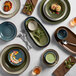 An Acopa rectangular heather gray china tray holding a plate, bowl, and utensils.