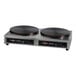 A black Krampouz dual electric crepe maker with two griddles.