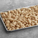 A tray of Tillamook Breaded Cheddar Cheese Curds on a table.