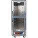 A large gray Metro C5 heated holding and proofing cabinet with clear Dutch doors.