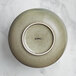 An Acopa Highlands heather gray bowl with a white ring on a counter.