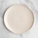 An Acopa Highlands white china plate on a marble surface.