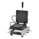 A Krampouz round Brussels style Belgian waffle maker with a black handle.