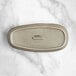 An Acopa Highlands heather gray rectangular china tray on a counter.