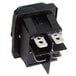 A black Noble Products power switch with two green lights.