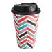 A white paper coffee cup with a black and red chevron pattern and a black lid.