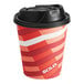 A red and white striped Solo paper hot cup with a black lid.