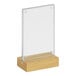 A Cal-Mil clear acrylic and oak base card holder.