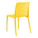 A yellow resin side chair by Lancaster Table & Seating.