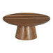 A Cal-Mil Sydney round walnut cake stand on a wooden table.