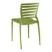 A Lancaster Table & Seating Sol Sea Moss Green Resin Side Chair with slatted backrest.