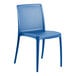 A blue resin chair with holes in the seat and back.