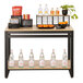 A Cal-Mil maple nesting merchandising table with shelves full of food and drink bottles.