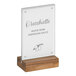 A Cal-Mil walnut base card holder with black text on a white sign.
