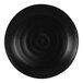 A black round melamine platter with a ripple pattern.
