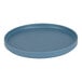 A blue round Cal-Mil melamine plate with a low rim.